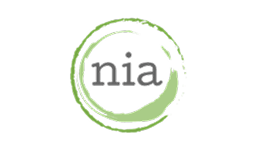 The letters "nia" are centered inside a green, incomplete circular brushstroke on a white background.